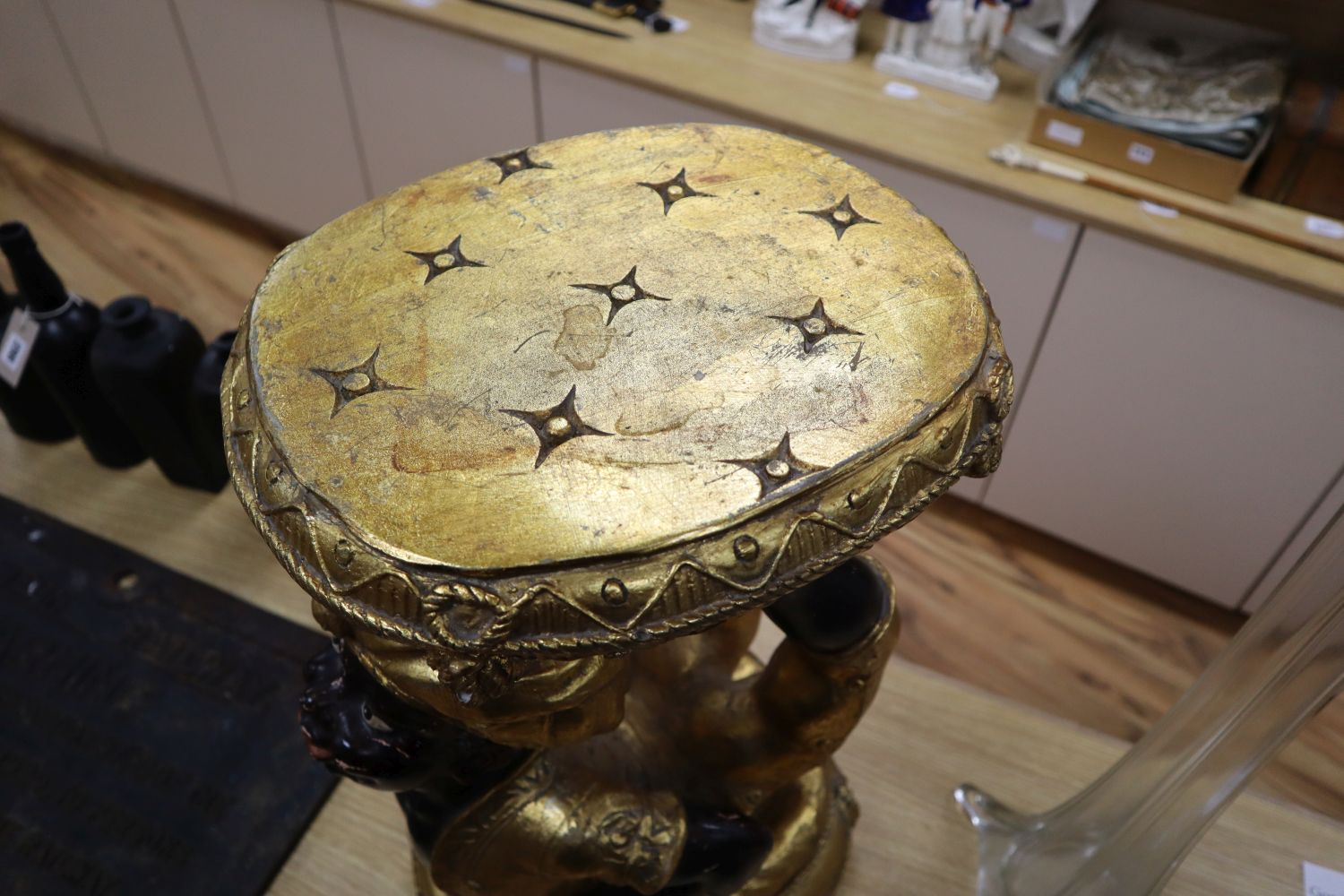 A composition blackamoor stool, height 57cm